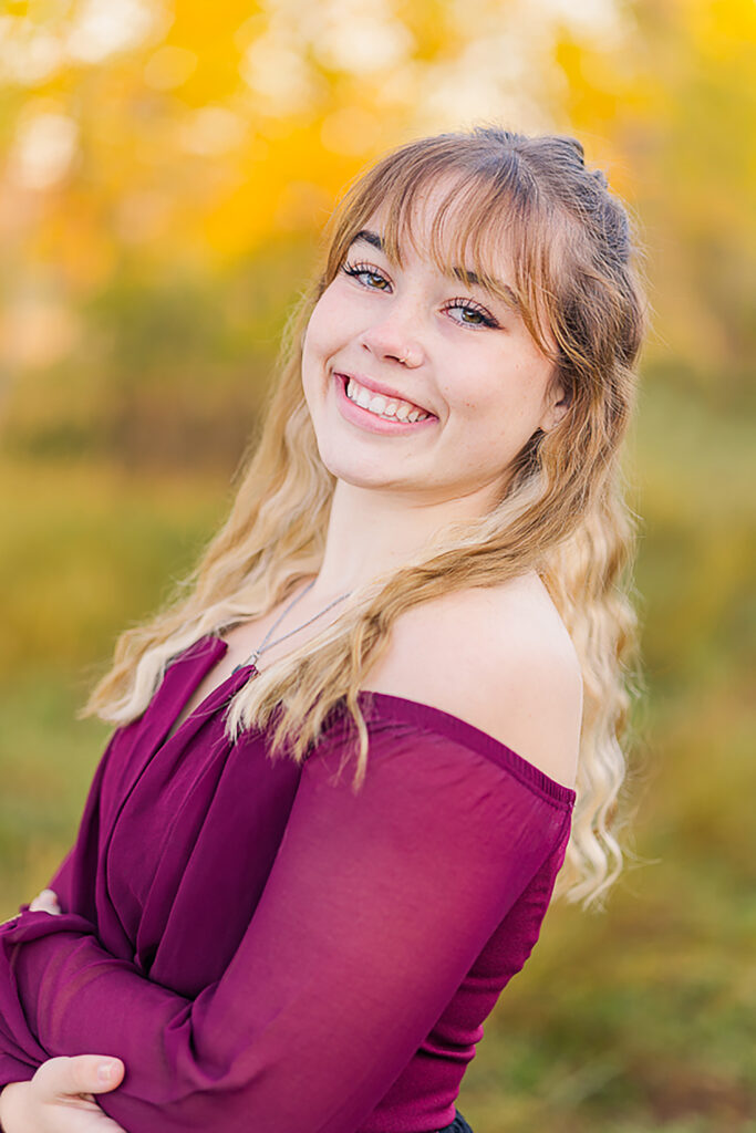 Authentic senior portrait of a teen girl with no retouching, captured outdoors by Northern Colorado senior photographer Heather Lilly