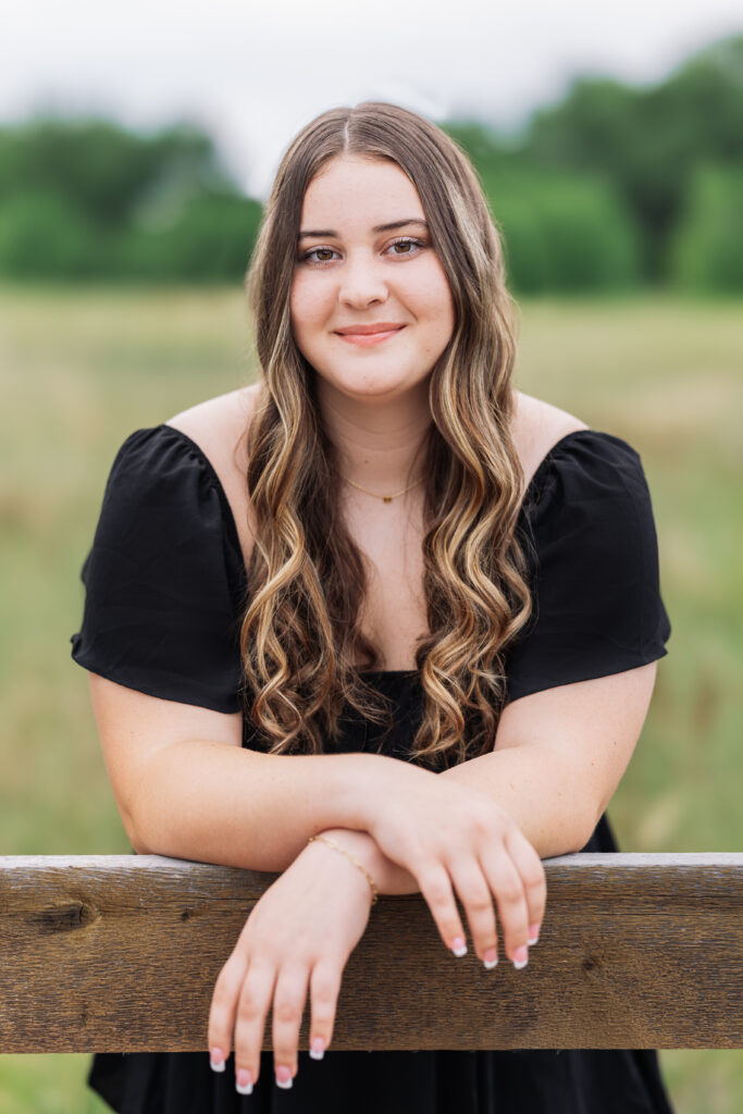 Senior portrait of a teen girl in a little black dress with a classic, Adele-inspired look, photographed by Northern Colorado senior photographer Heather Lilly Photography