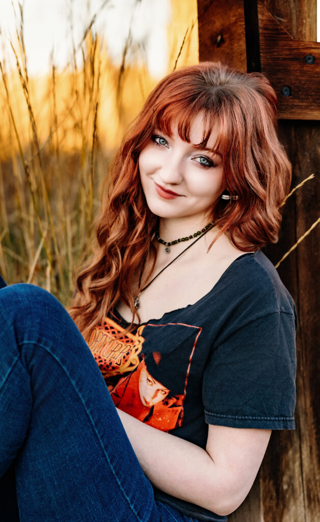 Senior portrait of a redheaded teen girl with porcelain skin, photographed in natural light by Northern Colorado senior photographer Heather Lilly
