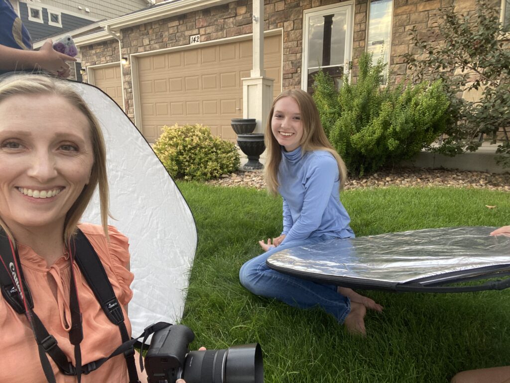 behind the scenes wind-blocking setup with reflectors at outdoor headshots theater session