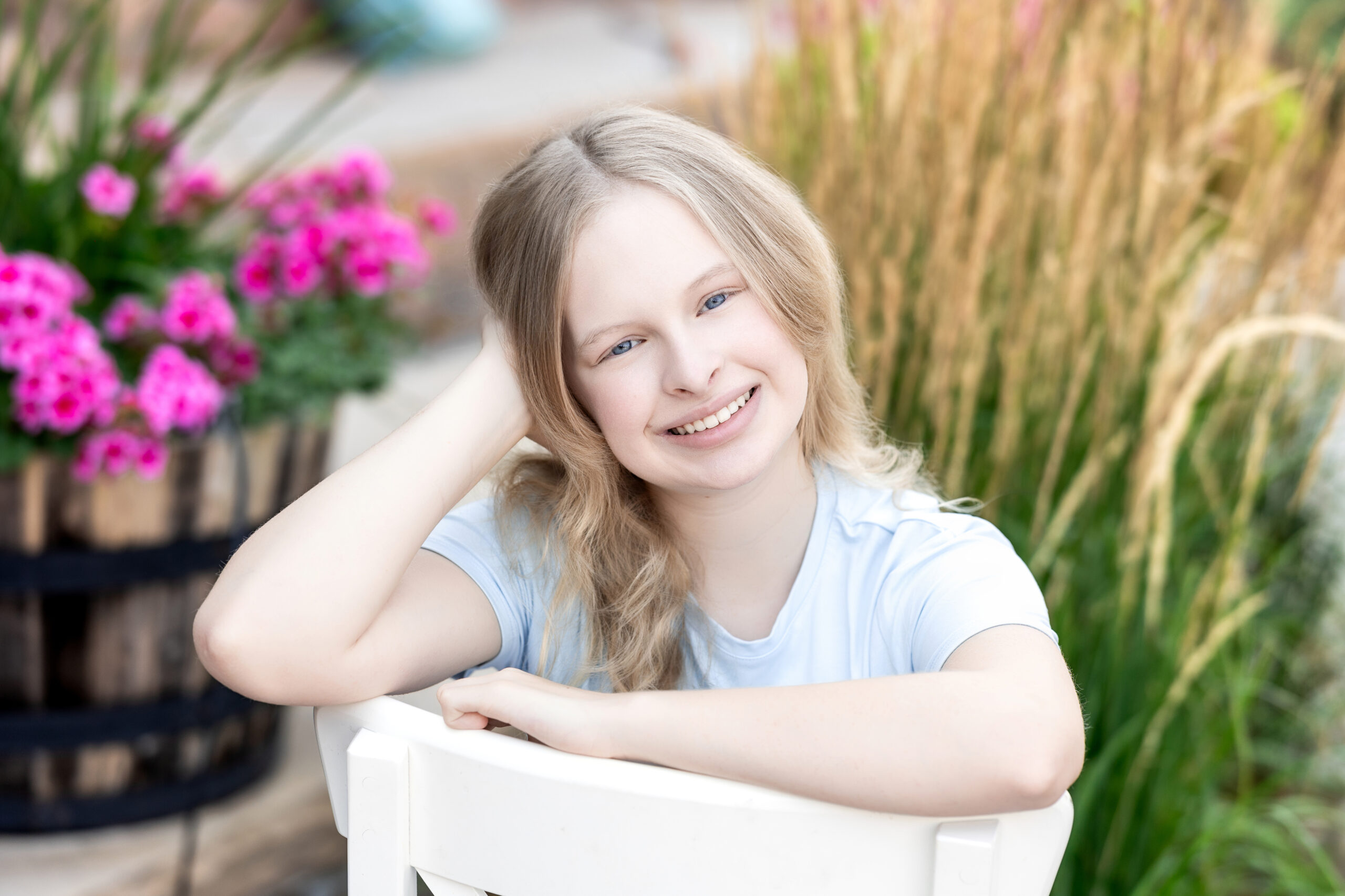 Teen girl smiling in natural light during back-to-school portrait session in Greeley, Colorado