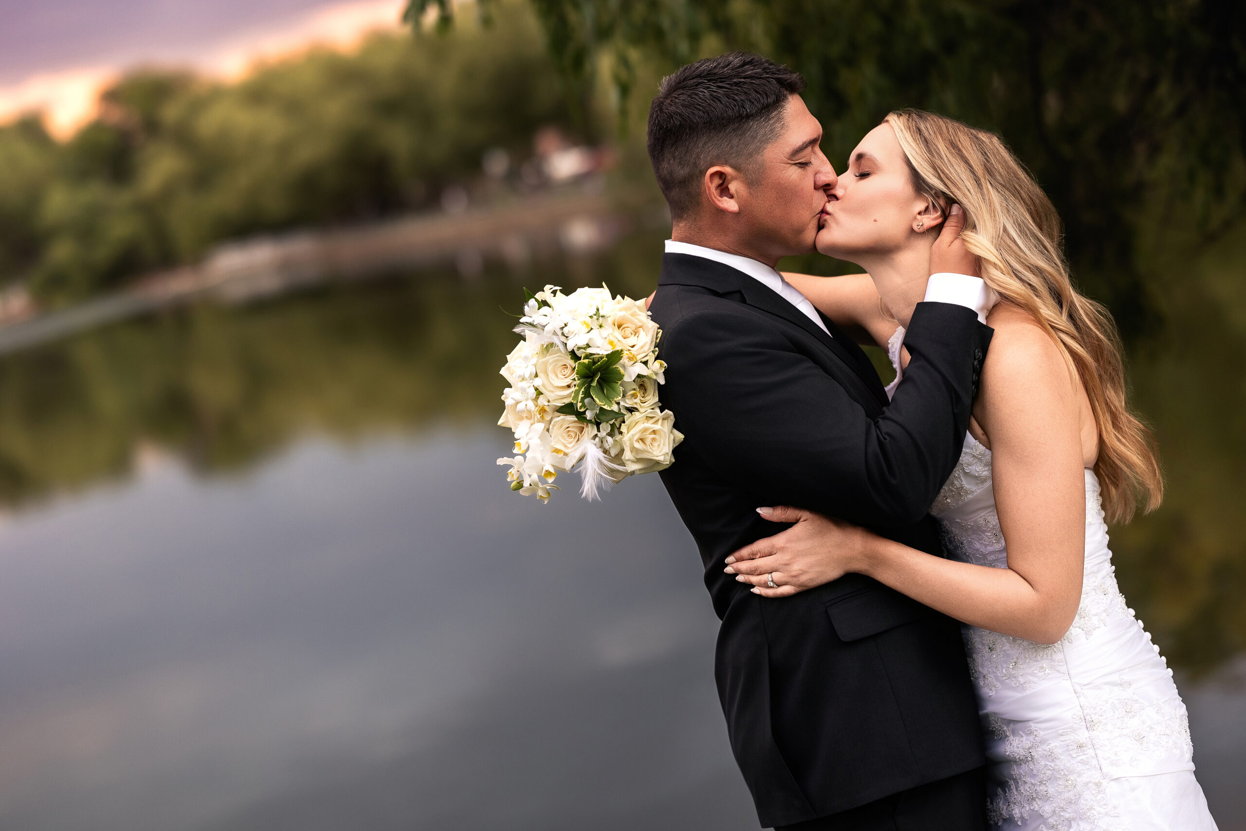 husband and wife kissing for anniversary portraits captured by Heather Lilly Photography