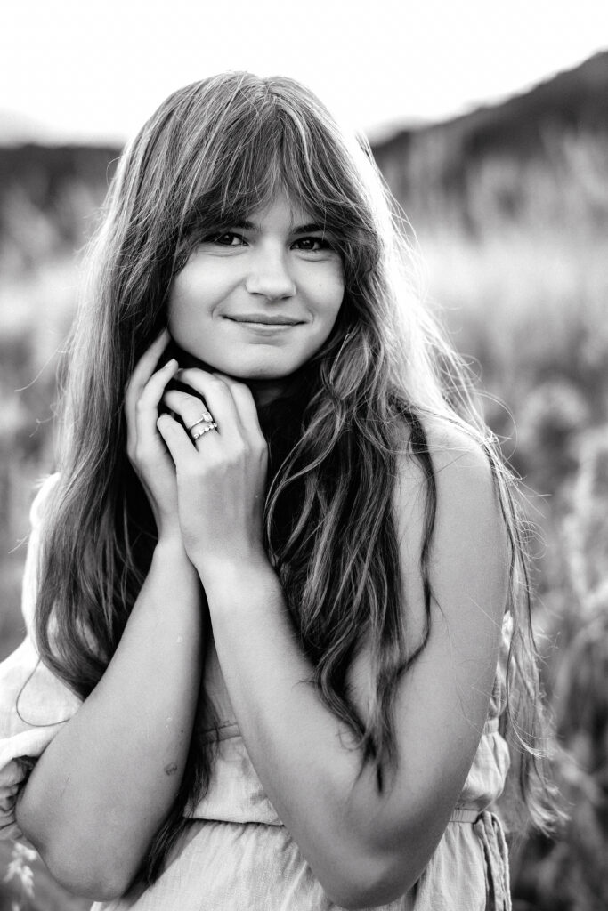 Timeless black and white portrait of Colorado wedding photographer Eden Alley with soft expression and natural light.