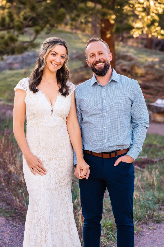 Husband and wife during vow renewal at Lily Lake in Estes Park Colorado, photographed by Northern Colorado photographer Heather Lilly at golden hour in the mountains.