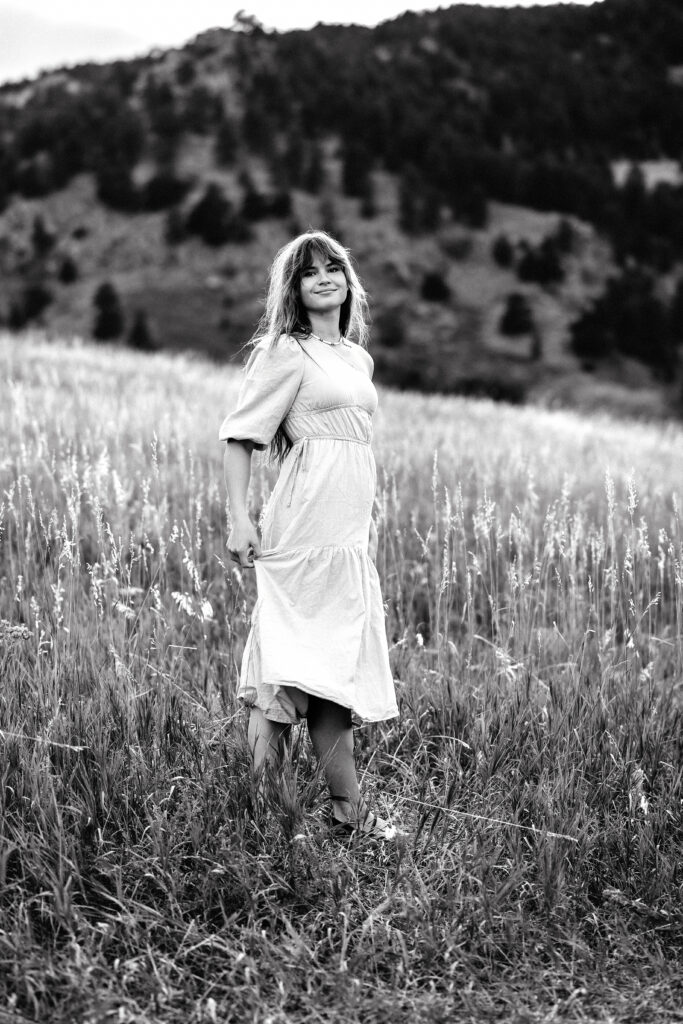 Classic black and white portrait of Eden Alley, Colorado wedding photographer, photographed in Boulder meadow.