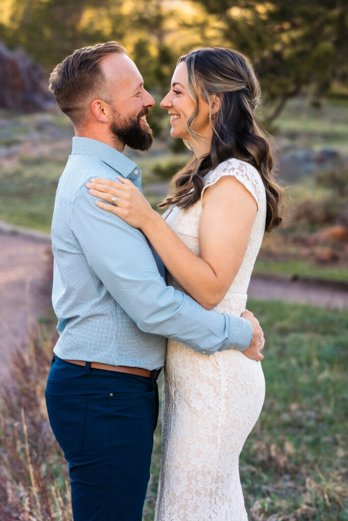 Husband and wife during vow renewal at Lily Lake in Estes Park Colorado, photographed by Northern Colorado photographer Heather Lilly at golden hour in the mountains.