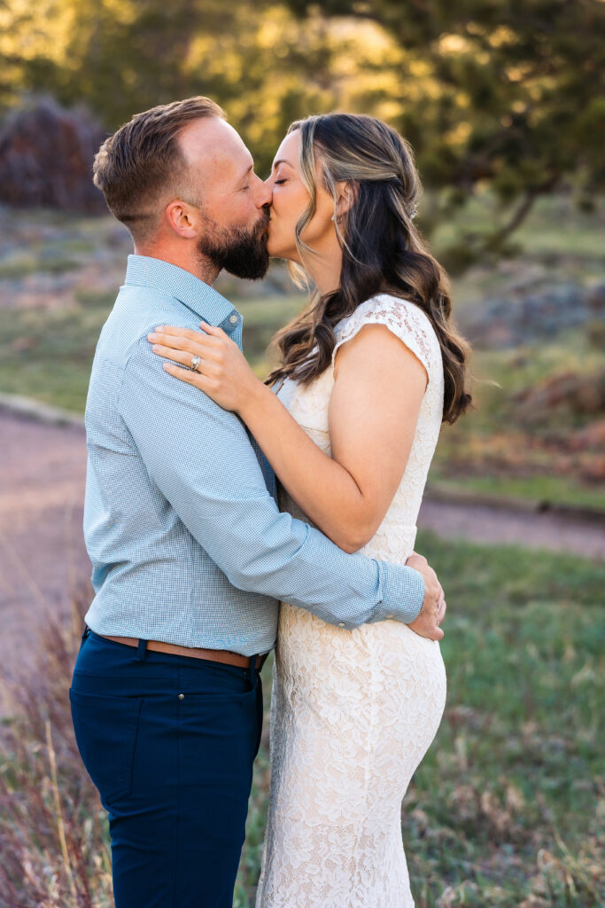 Husband and wife during vow renewal at Lily Lake in Estes Park Colorado, photographed by Northern Colorado photographer Heather Lilly at golden hour in the mountains.