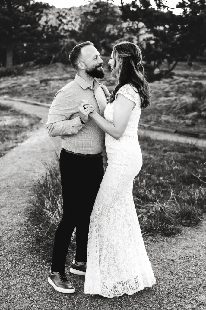 Husband and wife during vow renewal at Lily Lake in Estes Park Colorado, photographed by Northern Colorado photographer Heather Lilly at golden hour in the mountains.