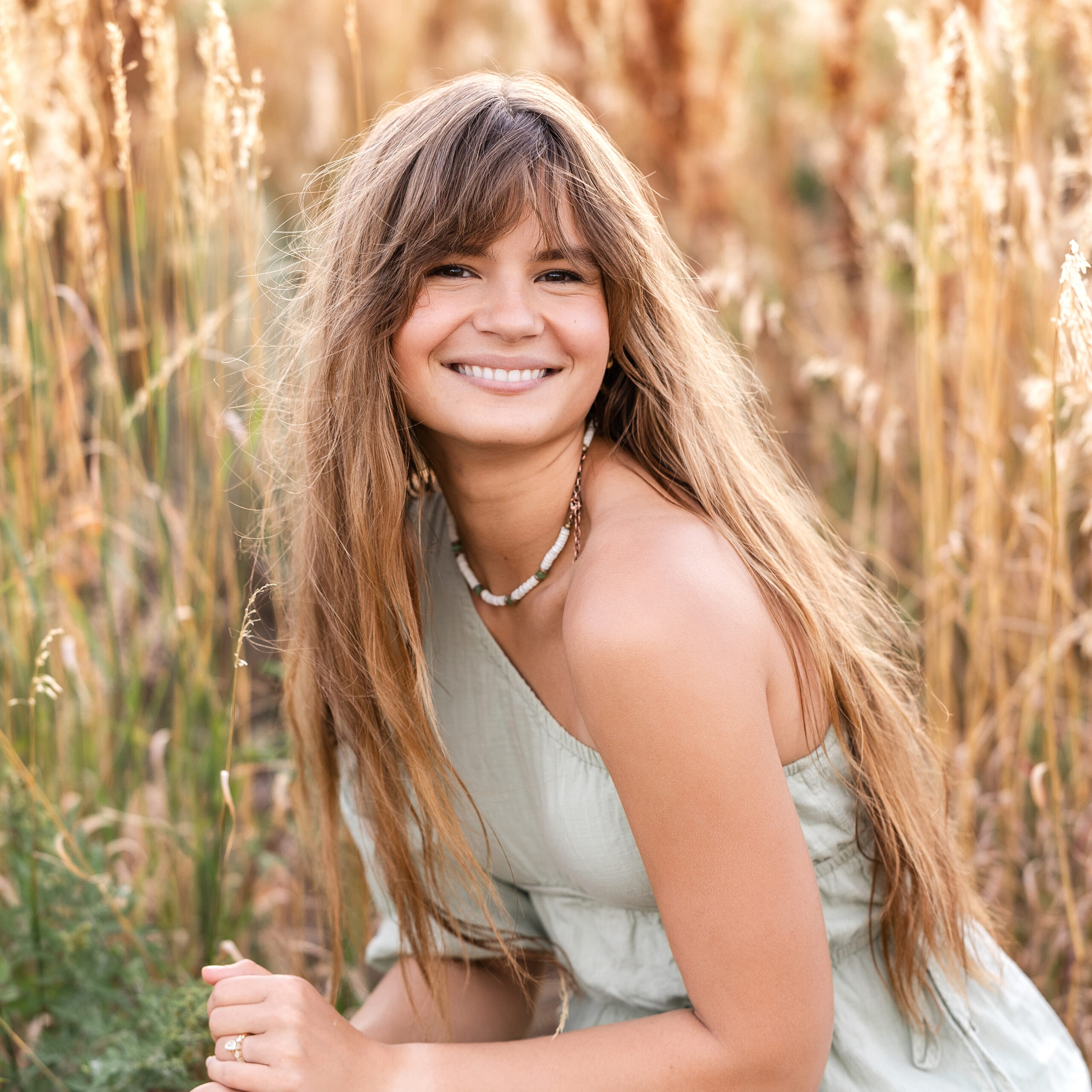 Film-inspired color portrait of Colorado wedding photographer Eden Alley at Chautauqua Park during golden hour.