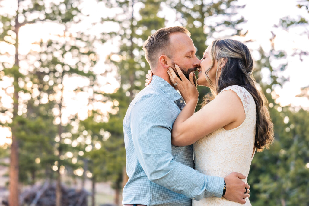 Husband and wife during vow renewal at Lily Lake in Estes Park Colorado, photographed by Northern Colorado photographer Heather Lilly at golden hour in the mountains.