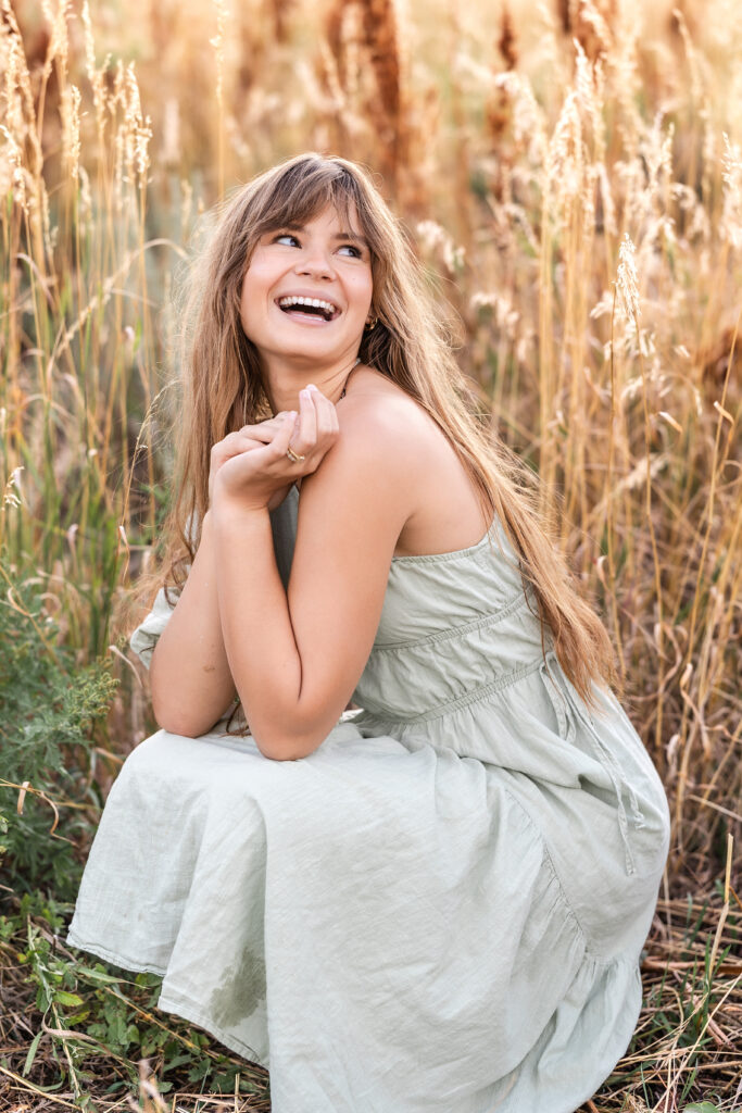 Warm autumn-toned portrait of Eden Alley, smiling , Chautauqua Park, Boulder.