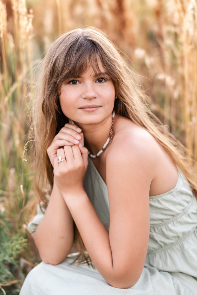 Color headshot of Eden Alley with soft expression, natural film-inspired tones by Heather Lilly Photography.