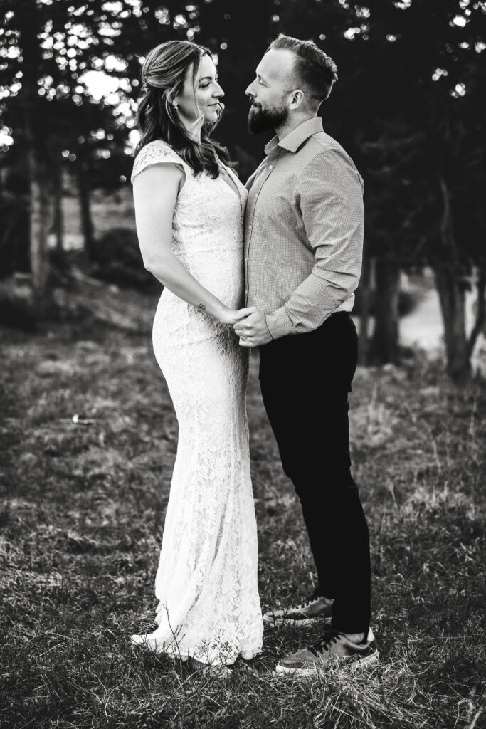 Husband and wife during vow renewal at Lily Lake in Estes Park Colorado, photographed by Northern Colorado photographer Heather Lilly at golden hour in the mountains.