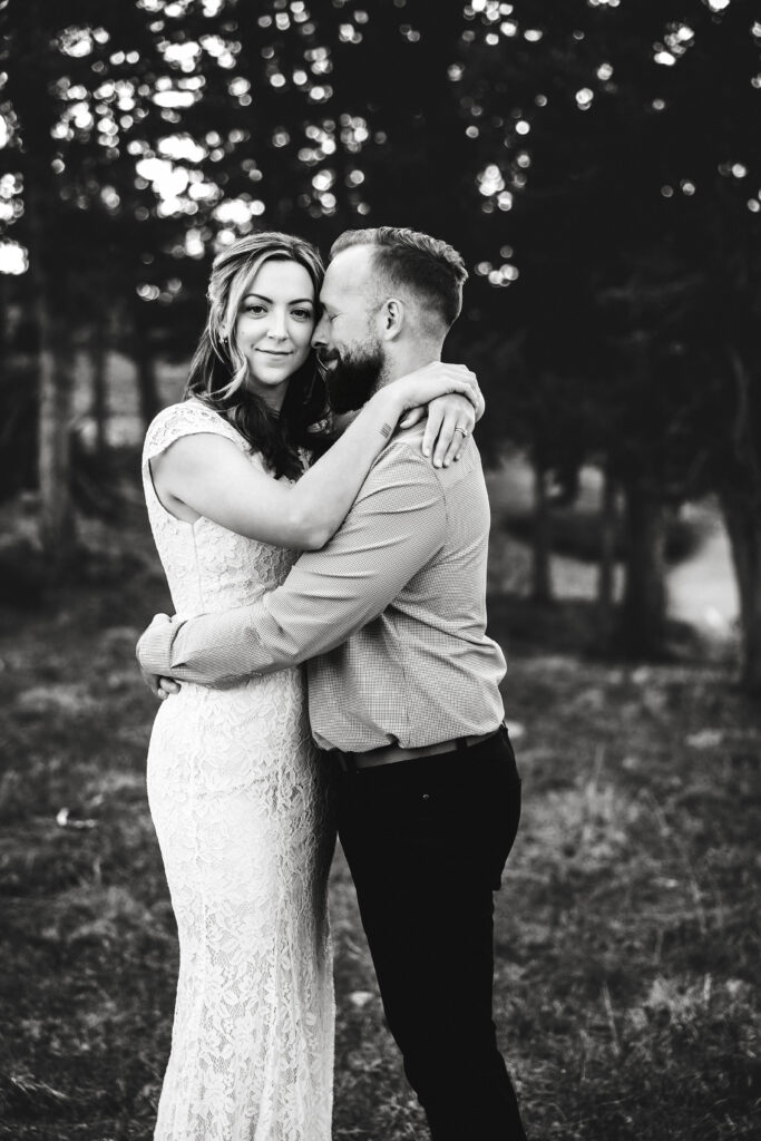 Husband and wife during vow renewal at Lily Lake in Estes Park Colorado, photographed by Northern Colorado photographer Heather Lilly at golden hour in the mountains.