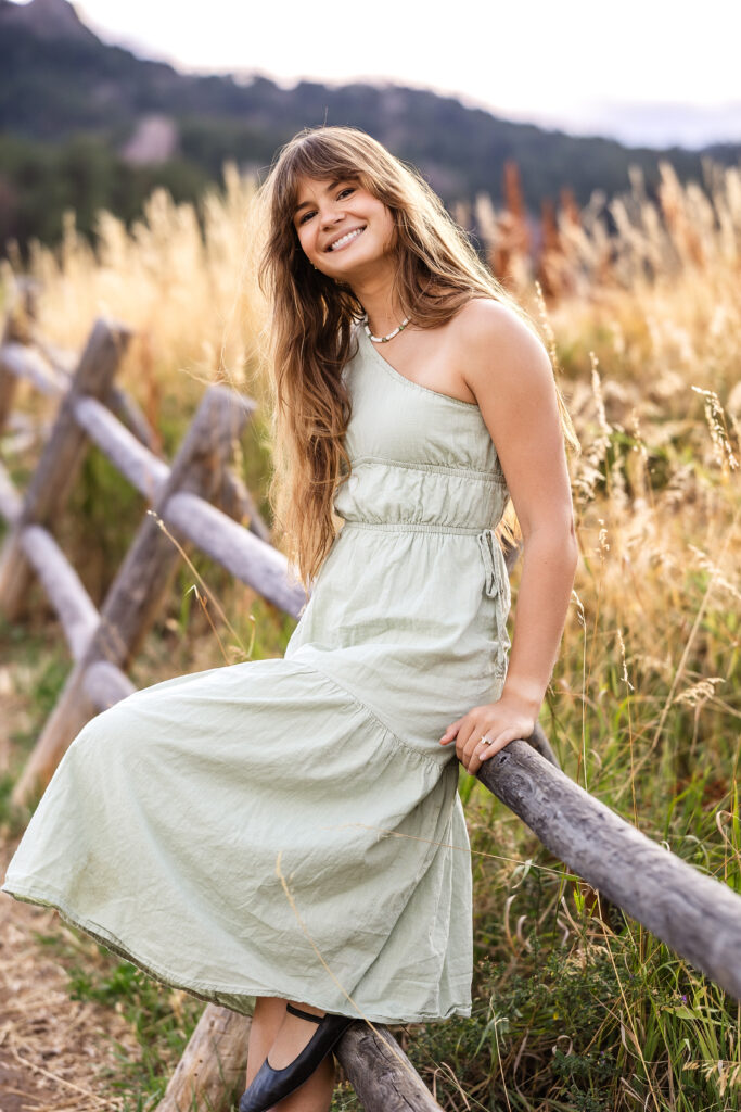 Film look portrait of Eden Alley in meadow grasses, warm color tones by Heather Lilly Photography.