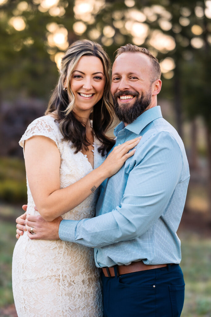 Husband and wife during vow renewal at Lily Lake in Estes Park Colorado, photographed by Northern Colorado photographer Heather Lilly at golden hour in the mountains.