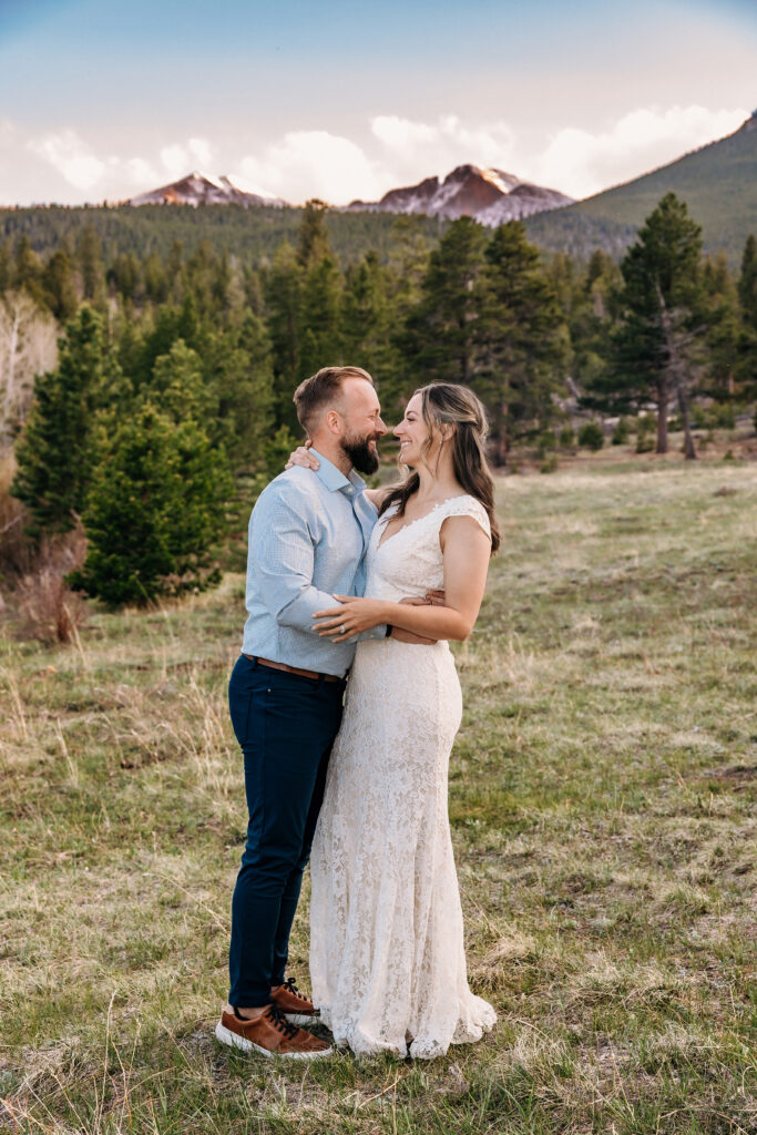 Husband and wife portraits during vow renewal at Lily Lake in Estes Park Colorado, photographed by Northern Colorado photographer Heather Lilly at golden hour in the mountains.