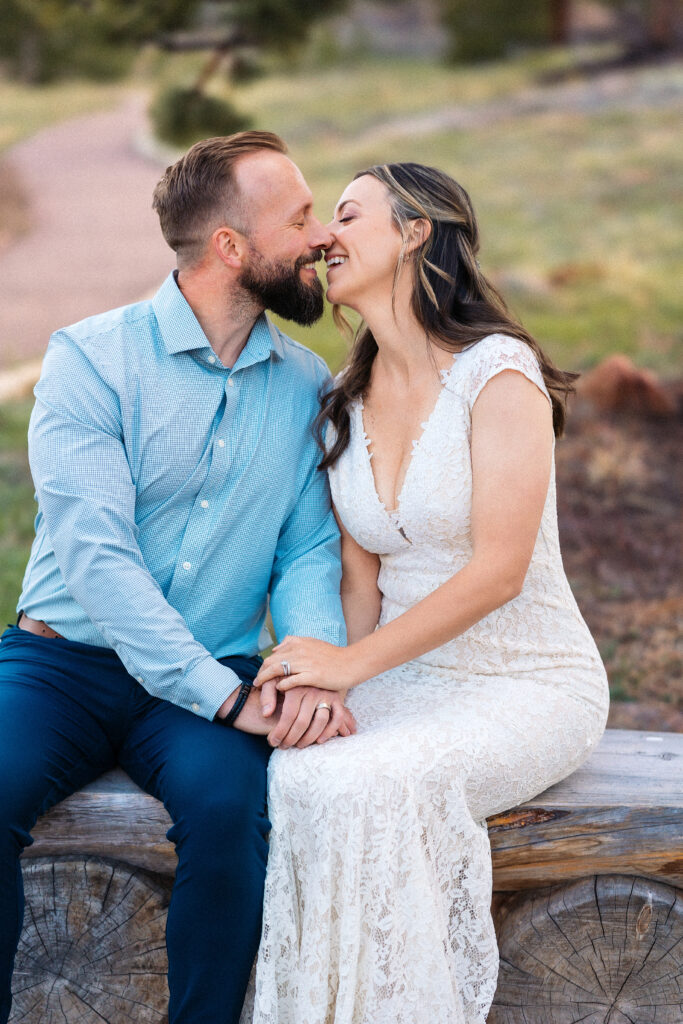 Husband and wife almost kissing during vow renewal at Lily Lake in Estes Park Colorado, photographed by Northern Colorado photographer Heather Lilly at golden hour in the mountains.
