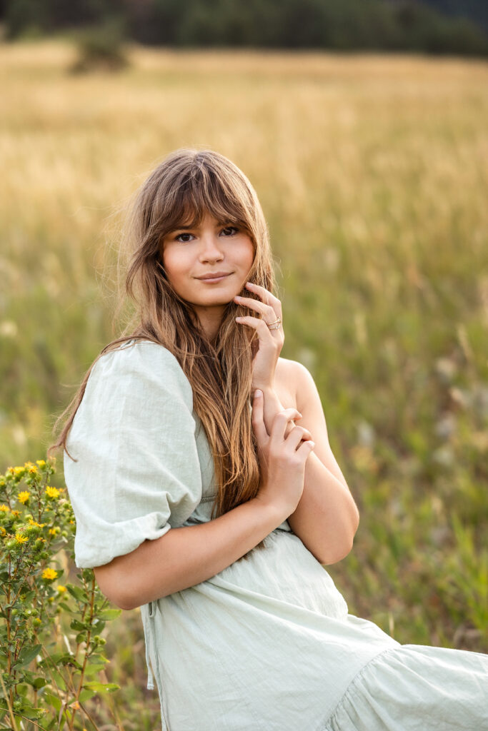 Dramatic editorial portrait of Eden Alley with windblown hair, film-inspired tones.