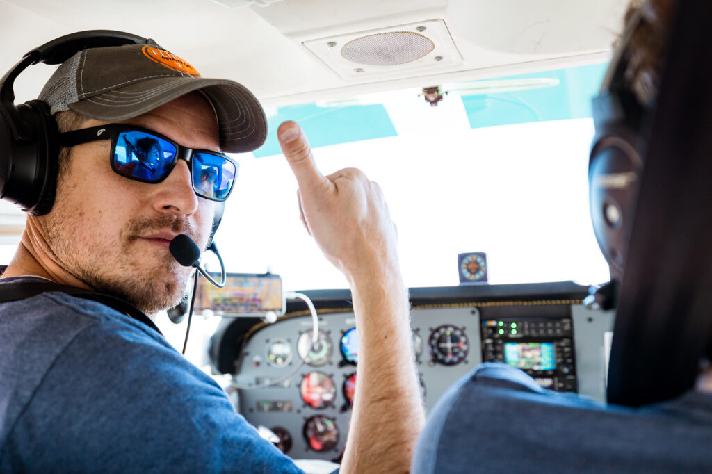 Pilot gives thumbs up & ready to go Cessna 172 Skyhawk preparing for takeoff at a northern Colorado airfield during a milestone first flight